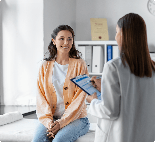 Potential sperm donor consulting with a medical professional during screening process